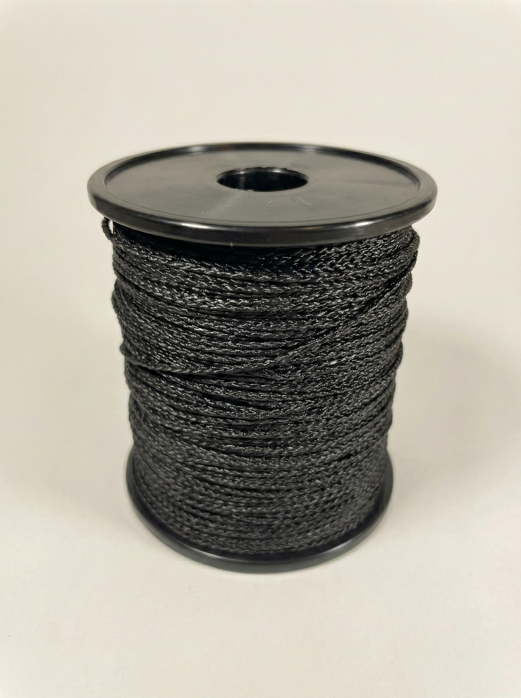 Black construction cord on spool